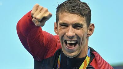 Michael Phelps celebrates after winning the gold medal in the men’s 4x100m final. (AP Photo/Martin Meissner)