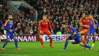 Gareth Bale shoots and scores the second goal for Wales against Andorra on Tuesday night in Euro 2016 qualifying. Rebecca Naden / Reuters