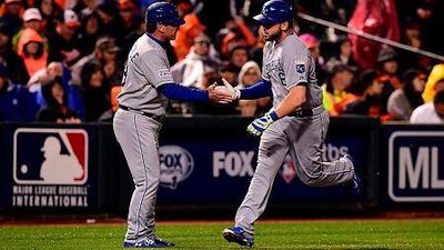 Mike Moustakas, right, of the Kansas City Royals runs the bases after hitting a two run home run to right center field against Brian Matusz of the Baltimore Orioles in the 10th inning during Game One of the American League Championship Series at Oriole Park at Camden Yards on October 10, 2014 in Baltimore, Maryland. Patrick Smith/Getty Images