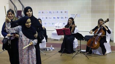 UAE composer Eman Al Hashimi works with children with autism on May 19, 2017, during a musical workshop at New England Centre in Abu Dhabi. Ravindranath K / The National