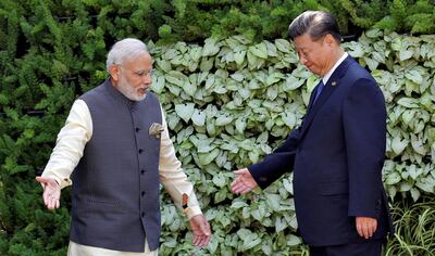 Indian Prime Minister Narendra Modi (L) and Mr Xi. Reuters