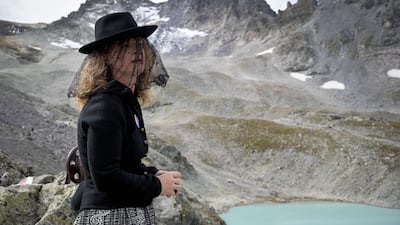 A woman takes part in a ceremony to mark the 'death' of the Pizol glacier (Pizolgletscher) above Mels, eastern Switzerland. AFP