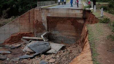 Members of the community walk near one of the many damaged roads and bridges in Chimanimani, 450 km east of the capital Harare, Zimbabwe after Cyclone Idai hit the area. Over 80 people have died, more than 100 still missing and thousands displaced as a result of the disaster. Neighbouring Mozaambique and Malawi have also have been affected by the cyclone. EPA