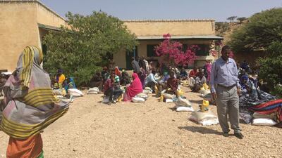 Omer Farah, director of the Taakulo Somali Community, distributed food to families in a village affected by drought. Courtesy Taakulo Somali Community.