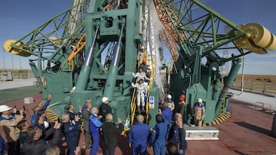 Nick Hague and Alexey Ovchinin wave farewell prior to boarding the Soyuz MS-10 spacecraft for launch. Getty Images