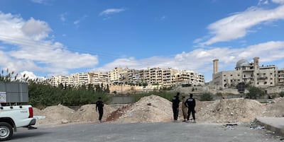 Syrian security personnel block an entrance to the Kurdish neighbourhood of Sheikh Maqsoud in Aleppo on October 8, 2025. Khaled Yacoub Oweis / The National
