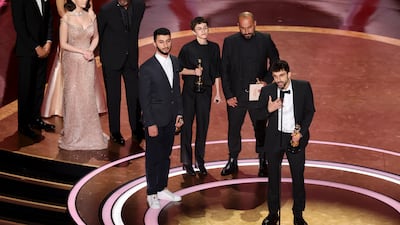 Yuval Abraham accepts the Oscar for Best Documentary along with co-directors, from left, Basel Adra, Rachel Szor and Hamdan Ballal. Getty Images