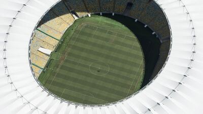 Aerial view of the Mario Filho (Maracana) stadium in Rio de Janeiro, Brazil, on December 3, 2013. The Maracana stadium will host the Brazil 2014 FIFA World Cup and the 2016 Summer Olympics. AFP PHOTO / YASUYOSHI CHIBA JAPAN OUT *** Local Caption *** 475183-01-08.jpg