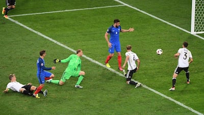 France's forward Antoine Griezmann, second from left, scores a goal past Germany's goalkeeper Manuel Neuer during their Euro 2016 semi-final at the Stade Velodrome in Marseille on July 7, 2016. AFP / PASCAL GUYOT