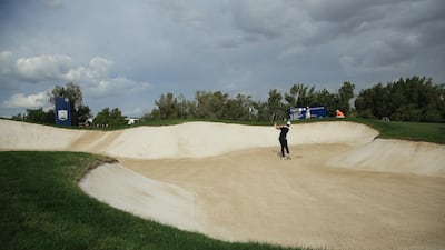 Rory McIlroy plays his third shot out of a bunker on the 12th hole during Day 1 of the DP World Tour Championship in Dubai on Thursday, November 21. Getty