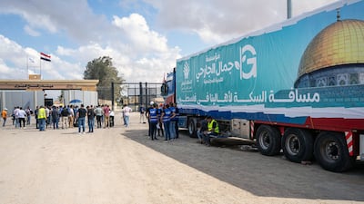 A truck from the humanitarian aid convoy is parked outside the Rafah border gate on Thursday. EPA