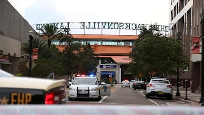 Police officers cordon off a street outside The Jacksonville Landing. Reuters
