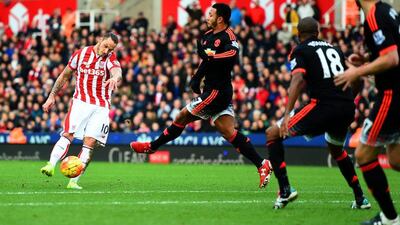 Marko Arnautovic of Stoke City shoots and scores his team’s second goal against Manchester United on Saturday in the Premier League. Laurence Griffiths / Getty Images
