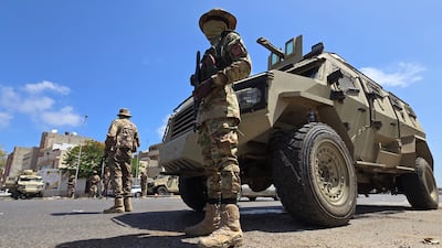 Libyan security forces at a checkpoint in Tripoli on Tuesday after overnight clashes killed six people. AFP