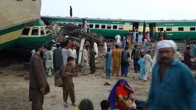 Five train carriages were derailed and twisted in the collision, requiring rescue workers to cut through metal to reach the injured. EPA
