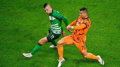 Juventus' Cristiano Ronaldo and Ferencvaros' Olekszandr Zubkov vie for the ball. EPA