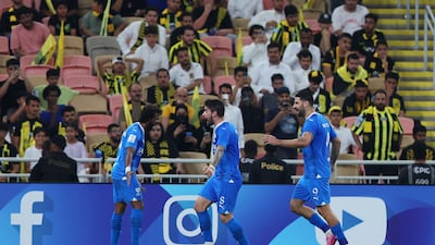 Yasser Al-Shahrani celebrates with teammates after scoring Al Hilal's first goal against Al Ittihad. Getty Images