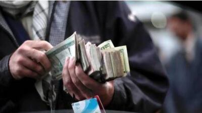 An Afghan street vendor touts prepaid Etisalat phone cards. The UAE company operates in the troubled nation, which has a reputation for corruption along with Ivory Coast and Pakistan. Mauricio Lima / AFP Photo
