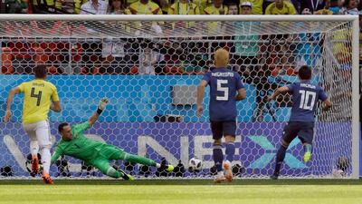 Match 15: Shinji Kagawa for Japan against Colombia. AP