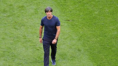 Germany head coach Joachim Low leaves the field at the end of his side's Group F match defeat to South Korea. AP