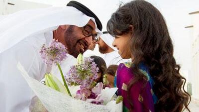 Sheikh Mohammed bin Zayed is greeted upon arriving at an bin Ablan Al Mazrouei's family home in Bani Yas.