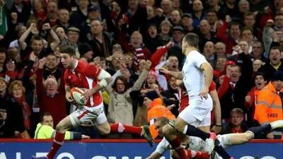 Alex Cuthbert of Wales goes past Mike Brown and Danny Care of England at the Millennium Stadium. Alex Livesey / Getty Images