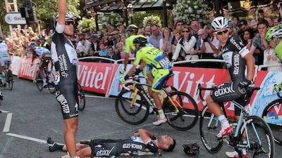 Mark Cavendish, ground, awaits treatment following his crash during the final sprint of the first stage of the 101st Tour de France on Saturday. Fred Mons / EPA / July 5, 2014