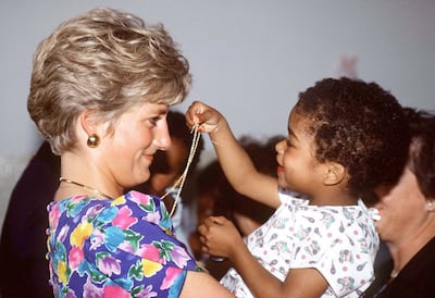 Princess Diana had a soft spot for children and was often photographed interacting with them. Getty Images