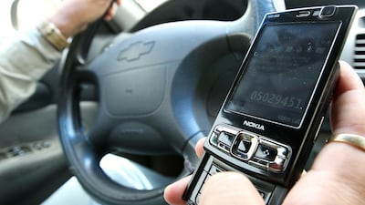 Motorist are still using mobile phones while driving despite various awareness campaigns, fines and accidents on the roads. Pawan Singh / The National