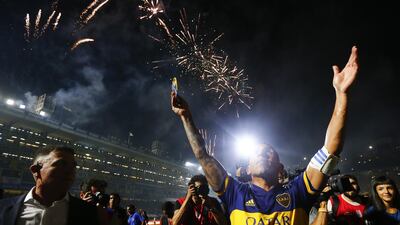 Carlos Tevez of Boca Juniors celebrates after winning the Argentinian Primera Division title at Alberto J. Armando Stadium in Buenos Aires on Saturday March 7. Getty