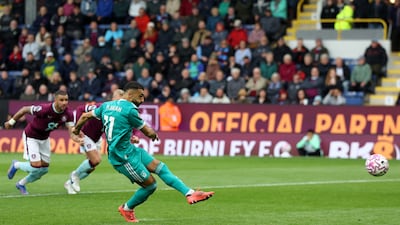 Mohamed Salah scores from the spot to earn Liverpool an injury-time win at Burnley. Reuters