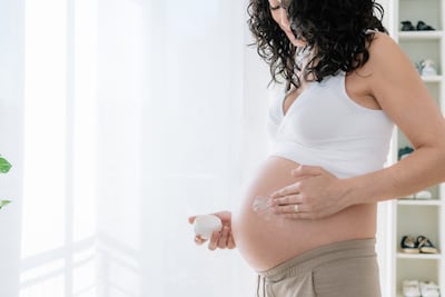 Rapid stretching of the skin can disrupt collagen and elastin, leading to stretch marks. Getty Images