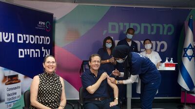 Israeli President Isaac Herzog and his wife Michal receive their third coronavirus vaccine injections at Sheba Medical Centre in Ramat Gan, Israel.