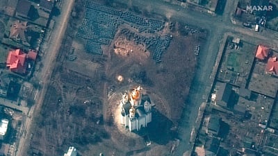 Maxar Technologies published images it said showed possible mass graves outside a church in Ukraine. AP