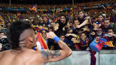 Neymar of Barcelona celebrates with fans after winning the UEFA Champions League Final between Juventus and FC Barcelona at Olympiastadion on June 6, 2015 in Berlin, Germany. on June 6, 2015 in Berlin, Germany. (Photo by Matthias Hangst/Getty Images)