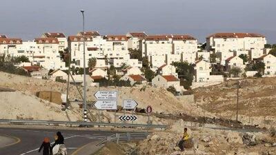 Bedouins ride donkeys in the West Bank Jewish settlement of Maale Adumim, near Jerusalem, where Israel intends to build a settlement.