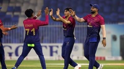Mohammed Rohid, centre, and captain Muhammad Waseem, right, are among the many Pakistani-origin players in the UAE team that will be playing in the T20 World Cup in India. Chris Whiteoak / The National
