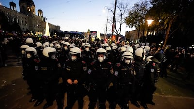 Police officers prepare to tackle anti-lockdown protesters in the Austrian capital. AP Photo