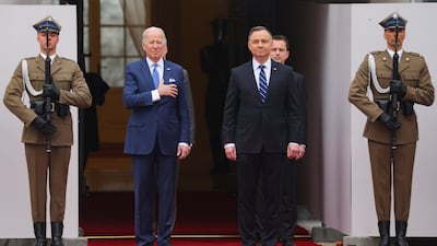 President Duda welcomes Mr Biden outside the Presidential Palace. Reuters