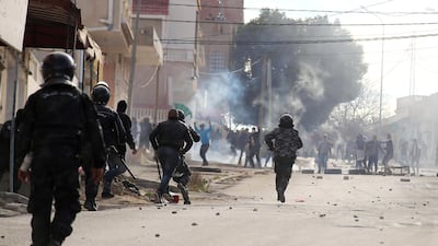 Tunisian riot police clash with protesters during demonstrations in Kasserine on December 25, 2018. Reuters