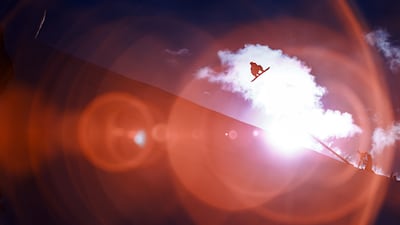 An athlete competes in the men's snowboard slopestyle qualification on day nine of the Milano Cortina 2026 Winter Olympic games at Livigno Snow Park on February 15, 2026 in Livigno, Italy