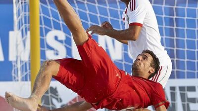 Jordan Santos, bottom, of Portugal fires a shot during the Beach Soccer Intercontinental Cup at Dubai International Marine Club on Wednesday. Courtesy Lea Weil