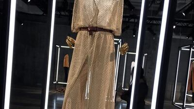 Diane von Furstenberg incorporated her signature “wrap” effect into a gold, filmy ensemble. Jocelyn Noveck / AP Photo