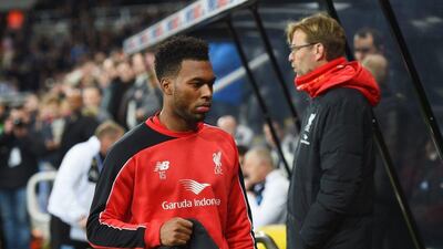 Daniel Sturridge of Liverpool walks to the bench past manager Jurgen Klopp during their Premier League match against Newcastle United on Sunday. Michael Regan / Getty Images / December 6, 2015