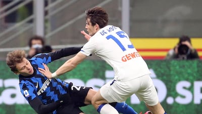 Inter's Nicolo Barella in action against Atalanta's Marten De Roon. EPA