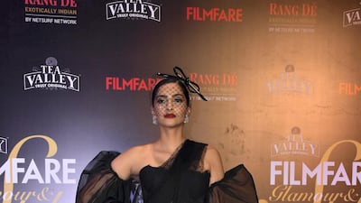 This is costumey but fun, Sonam Kapoor dialed up the old-cinema glam for the Filmfare Glamour and Style Awards: she wore a hat by famous milliner Philip Treacy and a dress with puffy statement sleeves by Shehla Khan. AFP