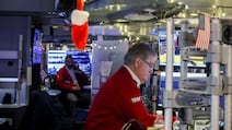 Traders at work on the floor of the New York Stock Exchange. The US market rose 10 per cent this year after gains of more than twice that in each of the previous two years. Bloomberg