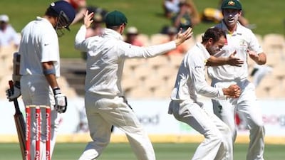 Nathan Lyon, second from right, took the crucial wicket of Sachin Tendulkar in Adelaide on Friday.
