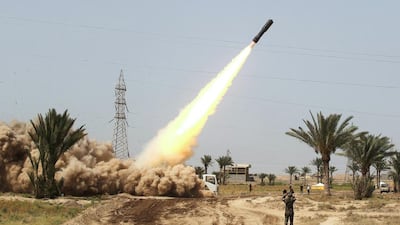 Iraqi pro-government forces and fighters from the Popular Mobilisation Units fire rockets from the village of Al Azraqiyah towards ISIL positions in the city of Fallujah on June 4, 2016. Ahmad Al Rubaye/AFP