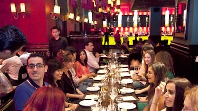Patrons meet at a dedicated Travel themed dinner organised by Restronaut at the Karma Kafe in Souk Al Bahar. Antonie Robertson / The National